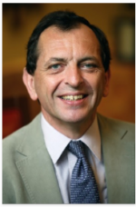 A smiling headshot of Graeme Pearce, dressed in suit, shirt and tie.