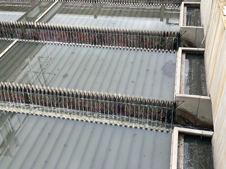 Ulu Pandan IVP primary clarifier, with the lamella plates visible beneath the surface
