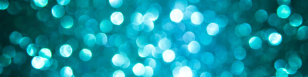 Abstract image of opaque white bubbles on a dark teal background.