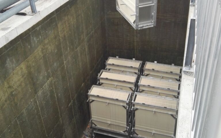 A photo of RisingSun membranes being installed in a tank onsite.